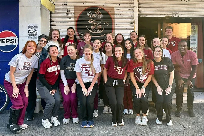 Selena Snowden (far left), teaching faculty III and director of Audiology Services in the School of Communication Science and Disorders, recently brought a group of 18 students to Guatemala for an annual service trip.