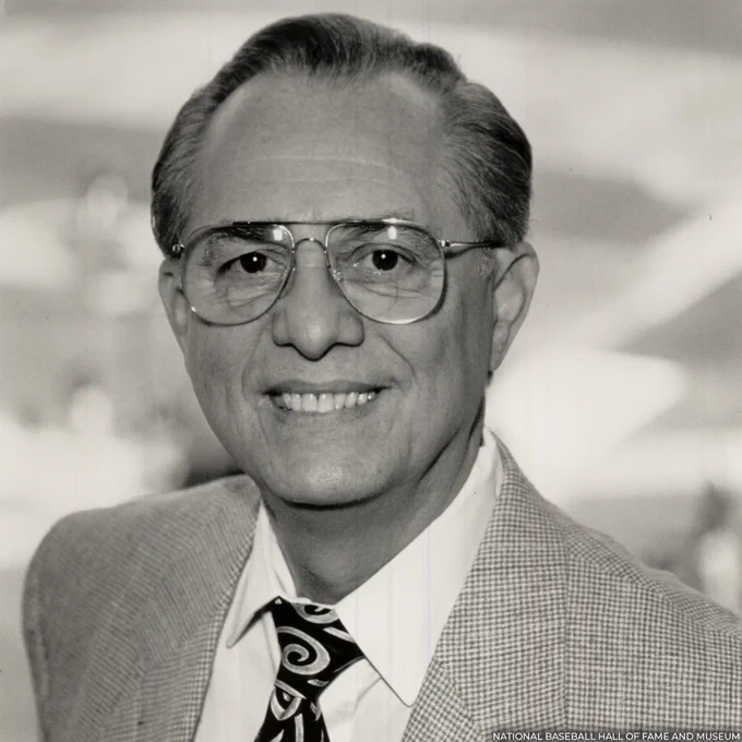 Head and shoulders portrait of René Cárdenas wearing a suit and tie. (National Baseball Hall of Fame and Museum)