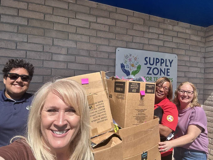Members of Georgianna Church and Brevard Schools Foundation staff pose together inside the Supply Zone beside boxes and bags filled with donated hygiene supplies. The group delivered nearly 2,500 pairs of underwear to help support students across Brevard Public Schools with essential everyday needs.