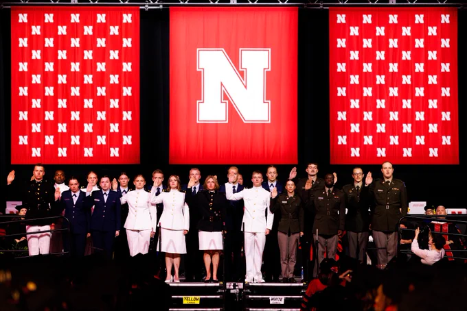 ROTC members in uniform recite the oath of enlistment onstage at Pinnacle Bank Arena. (Jordan Opp/University Communication and Marketing)