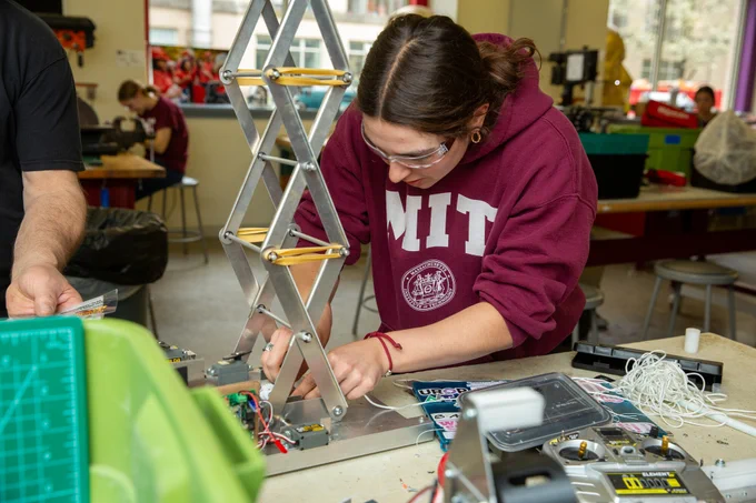A student works on a tower structure