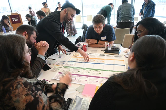 Living Climate Futures Symposium participants worked together to identify potential pros, cons and tradeoffs of allowing a data center to be built in a fictitious community. (Photo by Laura Frye-Levine)