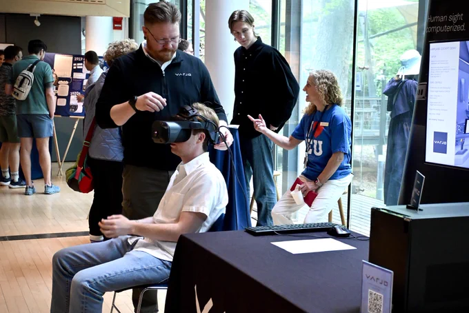 Varjo station with a visitor trying out 3D glasses.