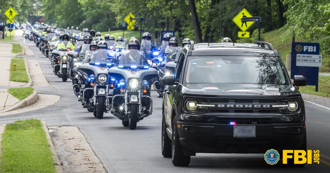 Photo of a Police motorcade. FBI Jobs logo present.