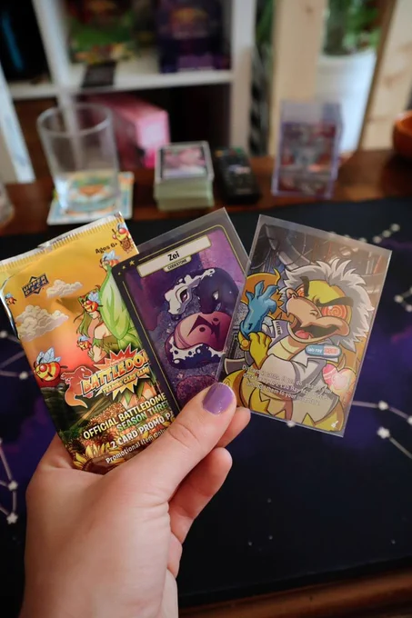 Season 3 Battledome Promo packs include two cards with a unique pixel foil, with special codestone art and a few exclusive art cards like this one. The packs usually include one of three unique codestones and one of the 15 play cards chosen from the most recent releases.