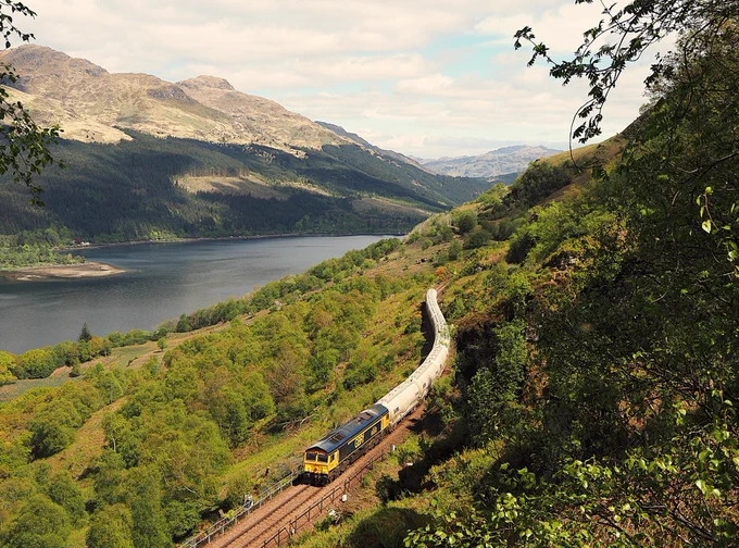 Yesterday's up (empty) Alcan 6E45 approaching Glen Douglas summit just after midday headed by 66303 ‘Preston North End’ attached. (11/05/26)

 