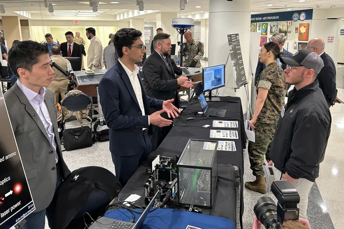 \nNaval Research Laboratory personnel discuss how using optics to manipulate lasers can increase their effectiveness when used in directed-energy weapons during lab day at the Pentagon, May 6, 2026.