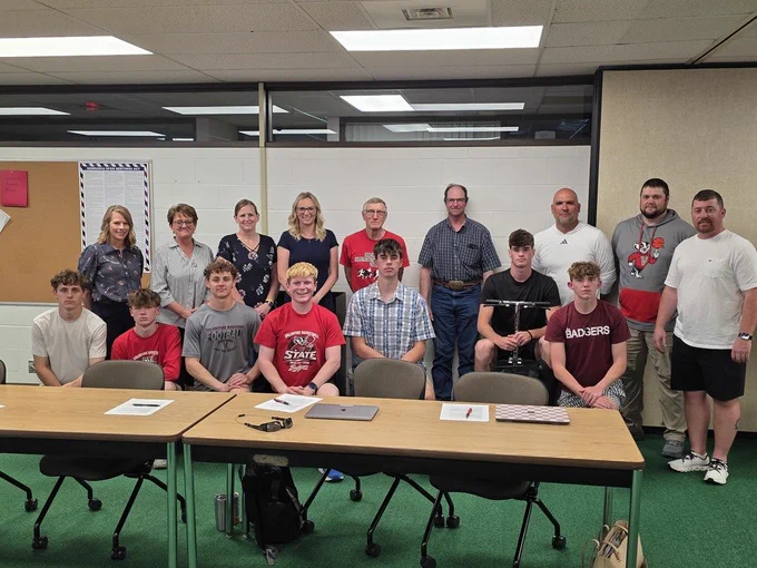 25-26 Boys Basketball Team with school board members