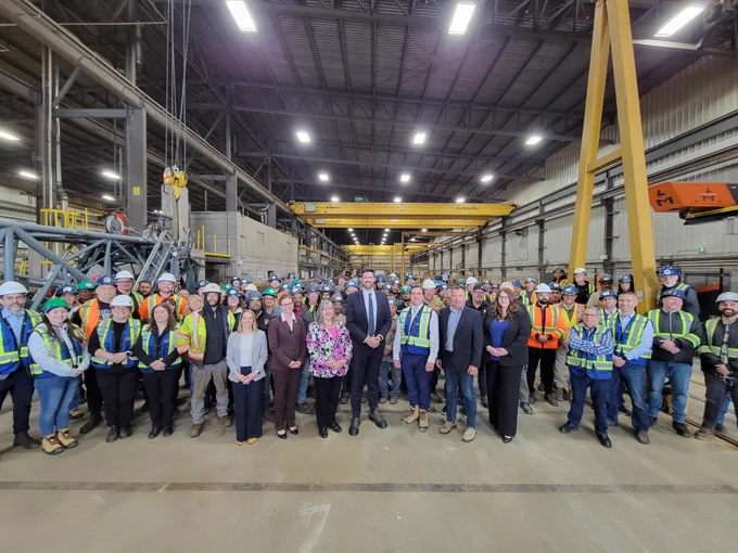 Group photo of Minister Fraser with event participants.