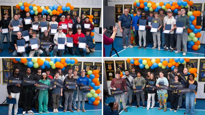 Group photo of students and their recognitions.