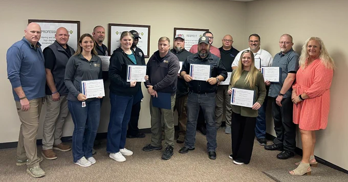 NEMBA graduates and instructors post with their certificates. 

Pictured are: (front row L to R): Maddison Frizzell, OEM; Lezlie Borak, OSDH; Kevin Long, OKC-Office of Emergency Management; John Yoder, Blaine Co. Emergency Management; Amy Tanner, Cherokee Nation Emergency Management; (back row L to R): Jason Junkens, Instructor, Ponca City Emergency Management; John Kannady, City of Bixby Emergency Management; Bryan Toney, City of Bixby Emergency Management; Stephen Scott, EMSSTAT; Bradley Wagnon, Cherokee Nation Emergency Management; Jackie Dimpsey III, OSDH; Leslie Phillips, McIntosh County Emergency Management; Norman Nieves, University of Oklahoma Emergency Management; Sean Vanhuss, NNSA PANTEX EM; Amy DeVore, Instructor, OEM, State Training Officer.