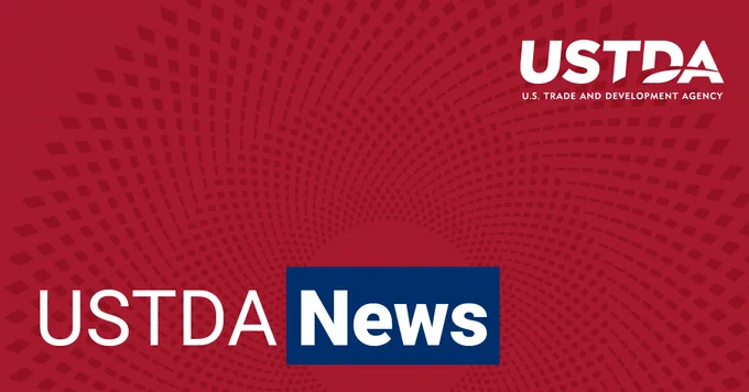 Abstract red graphic with blue and white text. Text reads: "USTDA News"