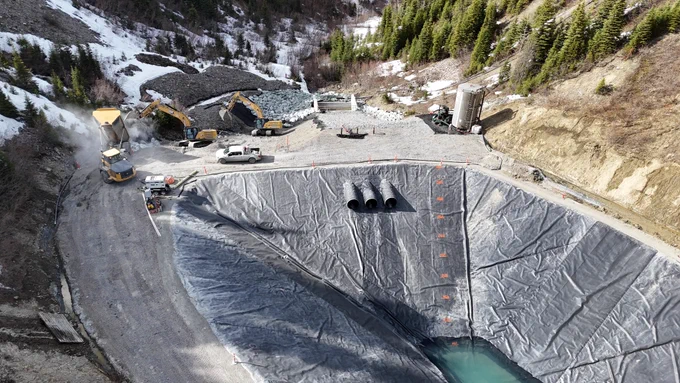 Sediment control pond (SCP) installed liner and placement of aggregates.