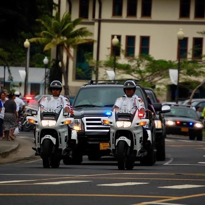 American Samoa law enforcement officers escorting an official motorcade. Photo credit: Stephen Petaia.