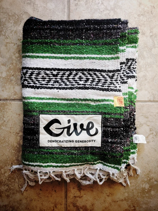 GiveWP blanket that was sent to my house after a wordcamp.