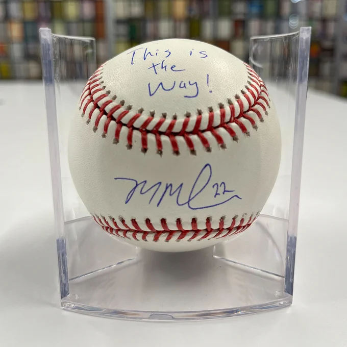 A Mason Miller signed baseball. Inscribed on the ball is "This is the way!"