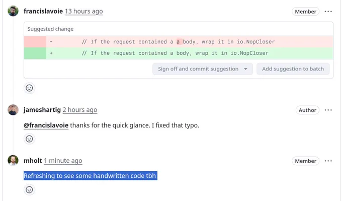 Pull request review that corrects a typo, implying the code was not written by AI/LLMs. Comment replies with "Refreshing to see some handwritten code to be honest"