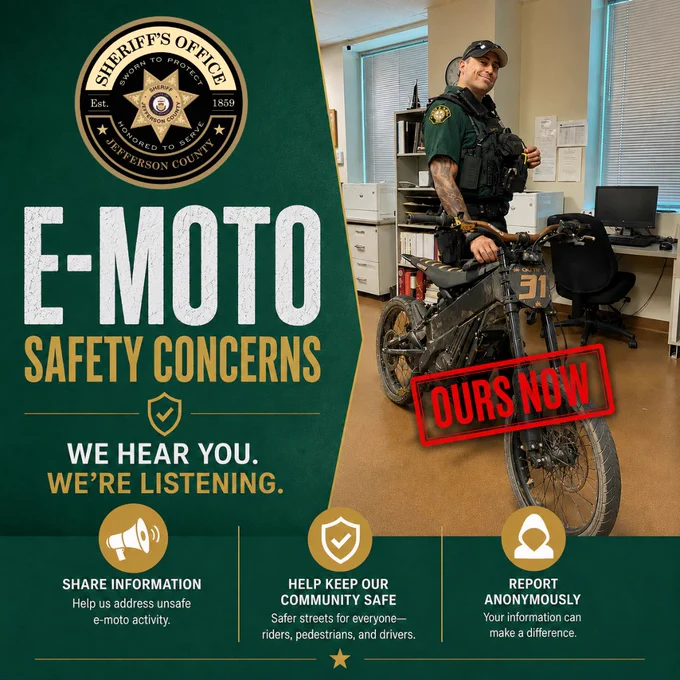Graphic from the Jefferson County Sheriff’s Office about e-moto safety concerns. Left side shows the Sheriff’s Office logo and large text reading, “E-Moto Safety Concerns. We hear you. We’re listening.” Right side shows a uniformed deputy standing beside a black electric motorcycle with a red “Ours Now” stamp over it. Bottom text encourages the public to share information, help keep the community safe, and report anonymously.