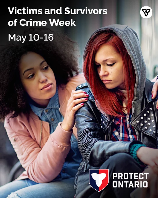 Young woman consoles a tearful friend in a hoodie; banner reads "Victims & Survivors of Crime Week, May 10–16."