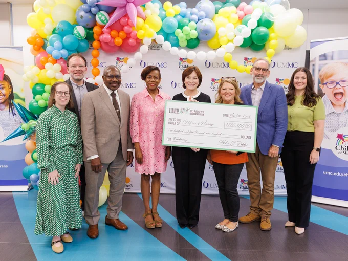 Members of the Hal's St. Paddy's parade and festival present a check to the children's hospital from left; Sophie Wolf, 2027 co-chair Hal's St. Paddy's parade and festival; Paul Wolf, 2027 co-chair Hal's St. Paddy's parade and festival; John Horhn, mayor of Jackson; Gail Horhn, first lady of Jackson; Dr. Mary Taylor, Suzan B. Thames Chair of Pediatrics and CEO of Children’s of Mississippi; Selena Daniel, Run the Rainbow chair; Malcolm White, founder, Hal's St. Paddy's parade and festival and Caitlin Foreman, executive director, Friends of Children's Hospital.