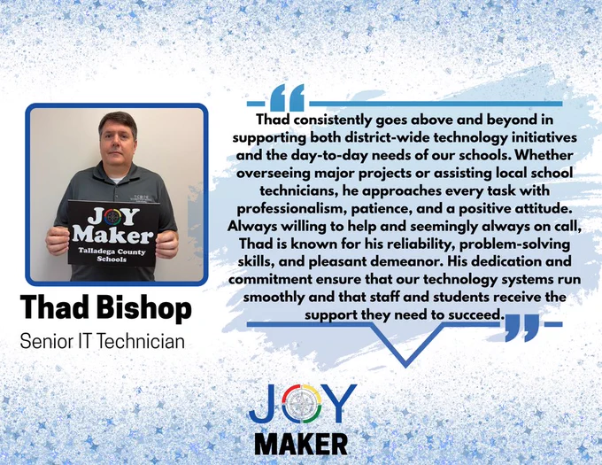 Thad Bishop Holding Joy Maker Sign