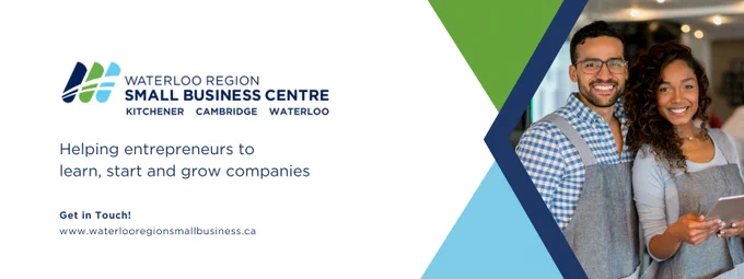 Image of two individuals smiling and standing in a business environment with text that says 'Waterloo Region Small Business Centre. Helping entrepreneurs to learn, start and grow companies www.waterlooregionsmallbusiness.ca"