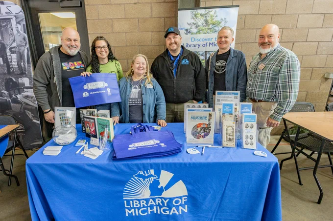 Library of Michigan Foundation board members/staff and Library of Michigan staff at the Library of Michigan table at Detroit Vinyl Fest at Eastern Market in Detroit.