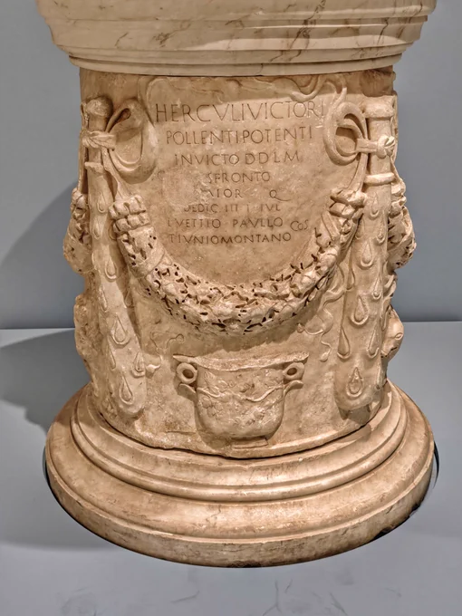ALTAR TO HERCULES VICTOR, 81 CE. CAPITOLINE MUSEUMS

"HERCVLI VICTORI POLLENTI POTENTI INVICTO D(ono) D(edit) L(ibens) M(erito) · C **[...]**S FRONTO **[...]**AIOR Q(æstor?) DEDICAVIT III I(dus) IVL(ias) L(ucio) VETTIO PAVLLO ET T(ito) IVNIO MONTANO CO(n) S(ulibus)"

"To Hercules the Victorious, the Mighty, the Powerful, the Unconquered, [Caius ...s] Fronto, the [---]ior, Quaestor, gave this gift willingly and deservedly; dedicated on the third day before the Ides of July, in the consulship of Lucius Vetitius Paullus and Titus Iunius Montanus."

This short, damaged inscription has a lot to unpack. The first three lines are punching hard with praise for Hercules Victor, here in the Forum Boarium a mercantile god, but its monumental squarish epigraphy veers off its central axis with the name of the dedicator, C. Fronto. The dedication date, 13 July 81, coincides with the end of the Ludi Apollinares, and a huge parade through the Forum Boarium, so Fronto's new altar would get attention. 