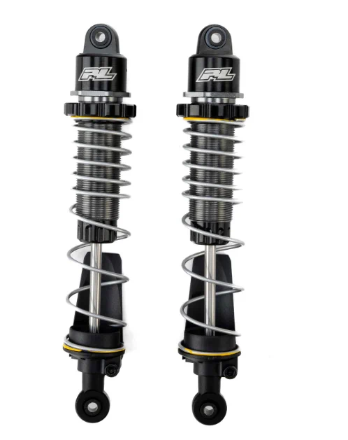 PowerStroke shocks are built for the kind of abuse bashers live for. Big jumps, hard landings, rough terrain, and zero mercy. What used to bounce, slap, and lose control now gets absorbed, settled, and sent right back with confidence. Every impact is controlled. Every landing stays composed. No drama, no chaos, just control when it matters most.

Built around true oil filled damping with a bleeder hole, these shocks deliver smooth, consistent performance run after run. The dual rate spring setup soaks up small bumps and stands firm under heavy compression, so you can push harder without the suspension falling apart underneath you. Threaded aluminum bodies let you dial in your setup, while hardened steel shafts and rock guards are ready for real world punishment.
