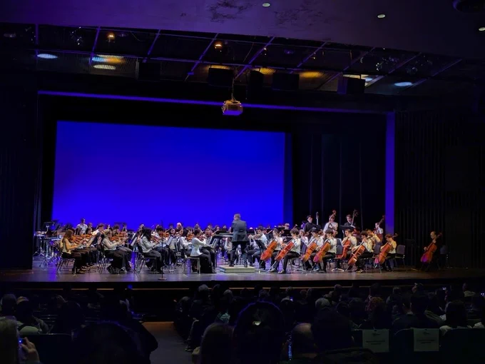 New Jersey Symphony Youth Orchestra students performing on stage.