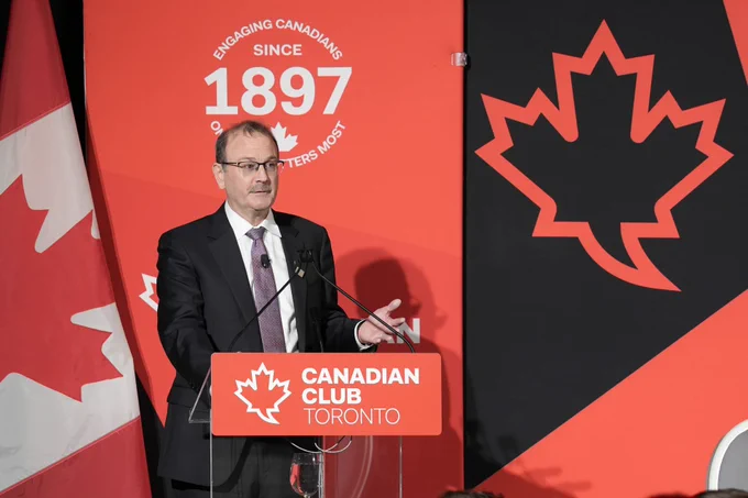 person speaking at a podium.