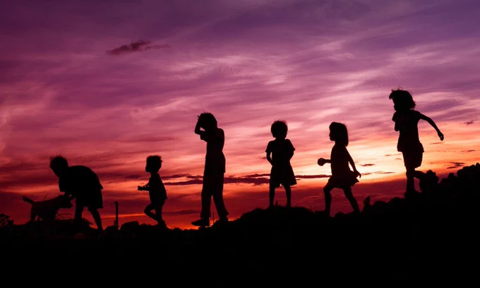 Group of children in silhouette from Rene Bernal at Unsplash. The image has been rotated, cropped, and resized.