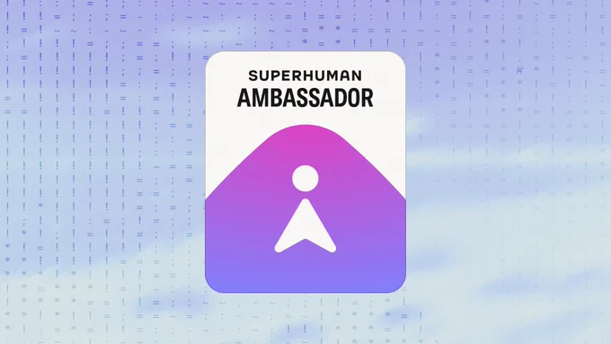 **Alt text:**

A "Superhuman Ambassador" badge on a light purple and blue gradient background with a subtle pattern of punctuation marks. The badge is a rounded white card featuring bold text reading "SUPERHUMAN AMBASSADOR" at the top, and below it a purple-to-violet gradient illustration of a stylized person icon — a circle for the head and a chevron shape for the body — set against a rounded mountain or hill shape.
