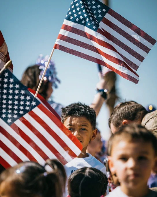 Children waving American Flags.