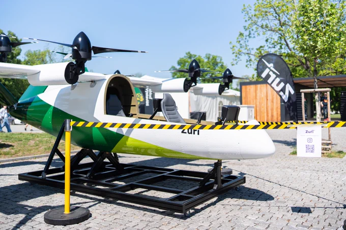 Zuri's TD 2.0 display aircraft with the Zuri banner behind it.