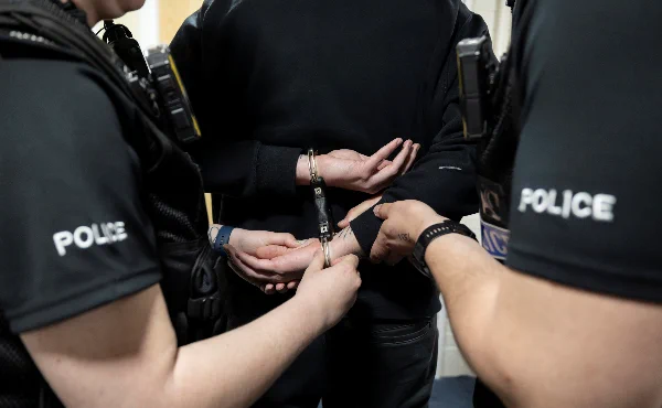 Person in handcuffs.
