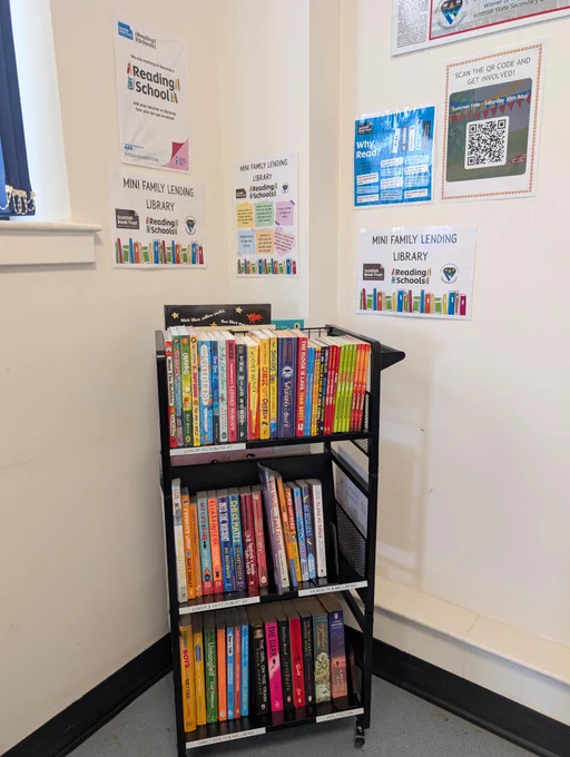 Mini family lending library in school waiting area
