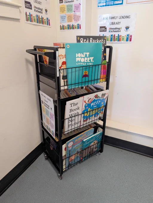 Mini family lending library in school waiting area