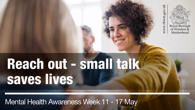A woman smiles warmly during a group discussion, with text promoting mental health awareness.