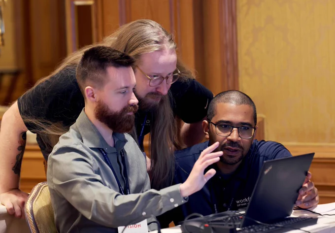 Training attendees staring intently at computer