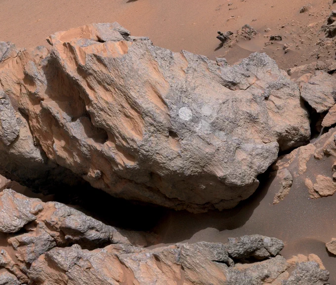 Close up of the circular abrasion patch on a rock.