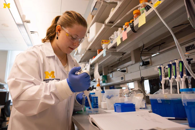 A member of the U-M Life Sciences institute working on research.