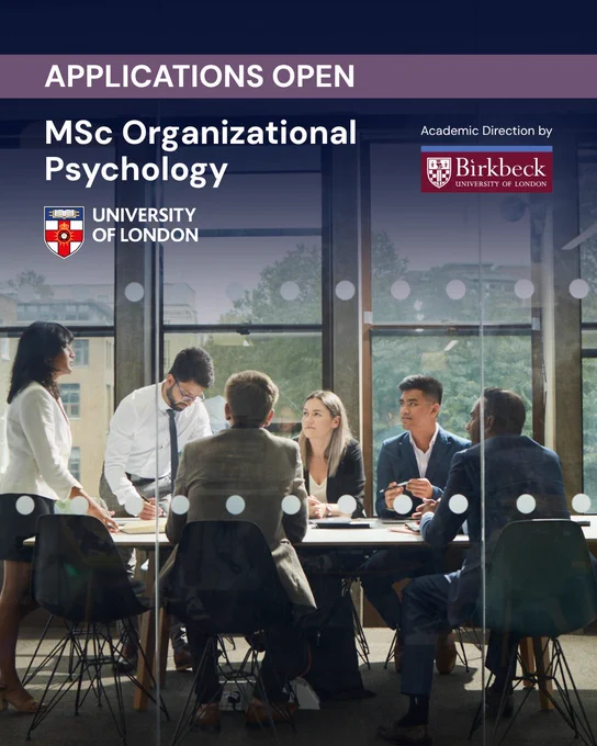 A group of people are seated around a conference table, engaged in discussion. The windows behind them show a cityscape with trees. The image text reads: "Applications open. MSc Organizational Psychology. University of London. Academic direction by Birkbeck, University of London."

