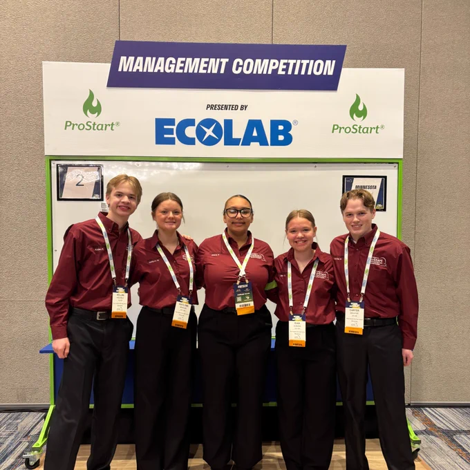 The Sauk Rapids-Rice High School team stands together at the ProStart Competition.