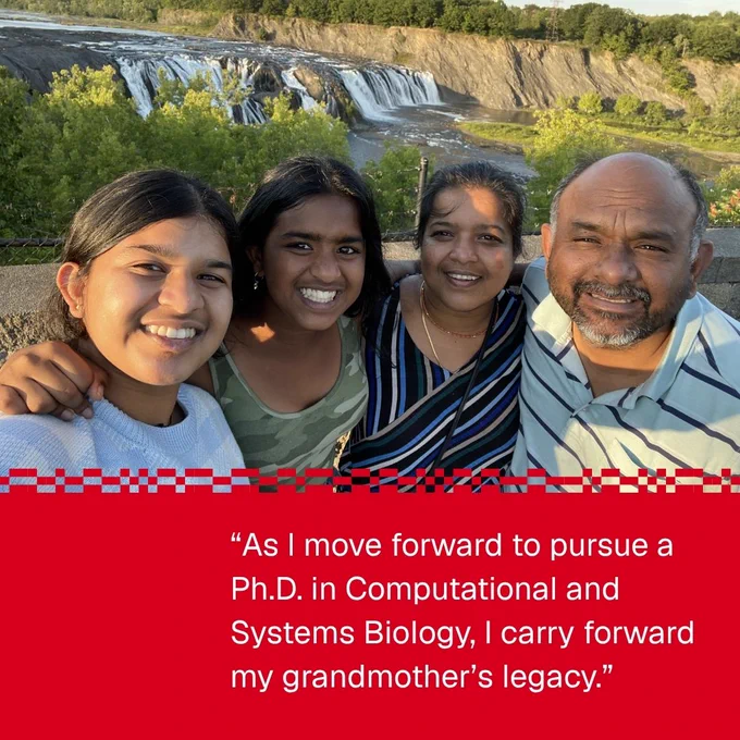 A group of four people smiling in front of a scenic waterfall with lush greenery. The image includes a quote about pursuing a Ph.D. in Computational and Systems Biology in honor of a grandmother's legacy.