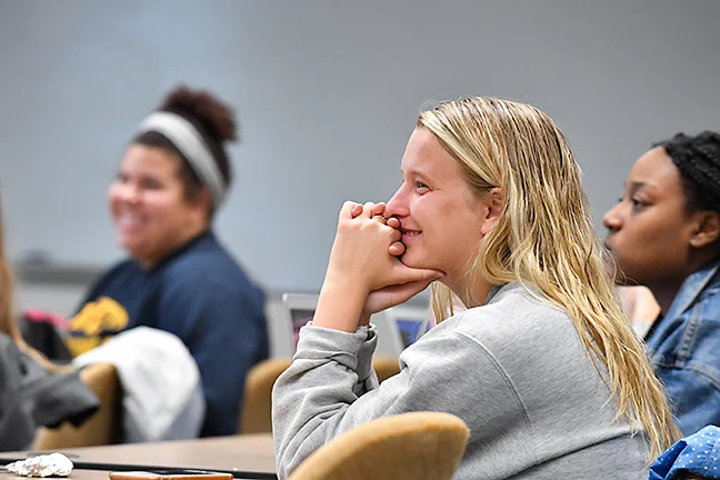 Classroom scene showing students paying close attention to a lecture or group activity.