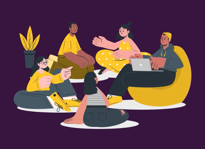 An illustrated group of friends sits on beanbags and the floor, engaged in lively discussion and collaborating with a laptop, within a cozy, purple-walled space.