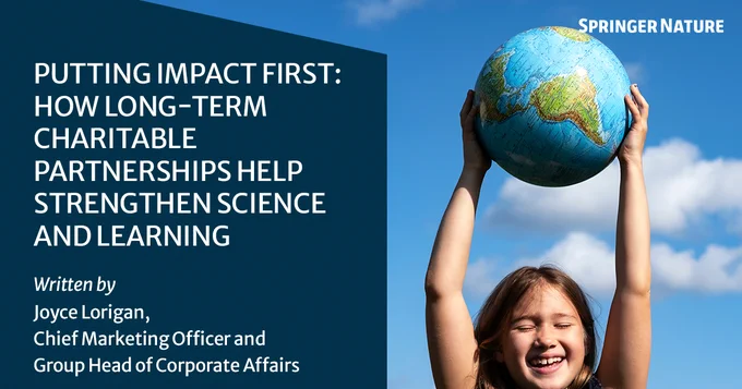 Against a blue sky, a smiling child holds a globe above their head. Text reads: \"Putting Impact First: How Long-Term Charitable Partnerships Help Strengthen Science and Learning. Written by Joyce Lorigan, Chief Marketing Officer and Group Head Corporate Affairs\"