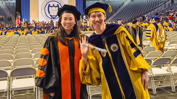 Georgia Tech CSE Ph.D. graduate Chengrui Li (right) takes a picture with his advisor, School of CSE Assistant Professor Anqi Wu (left)