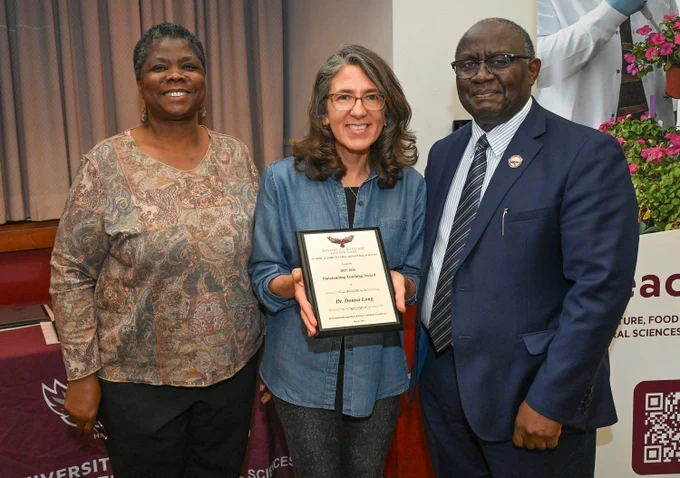 Human Ecology Outstanding Teaching Award winner Dr. Donna Long with Dean Dr. Moses T. Kairo and Chair Dr. Grace Namwamba at SANS end of the year awards event.